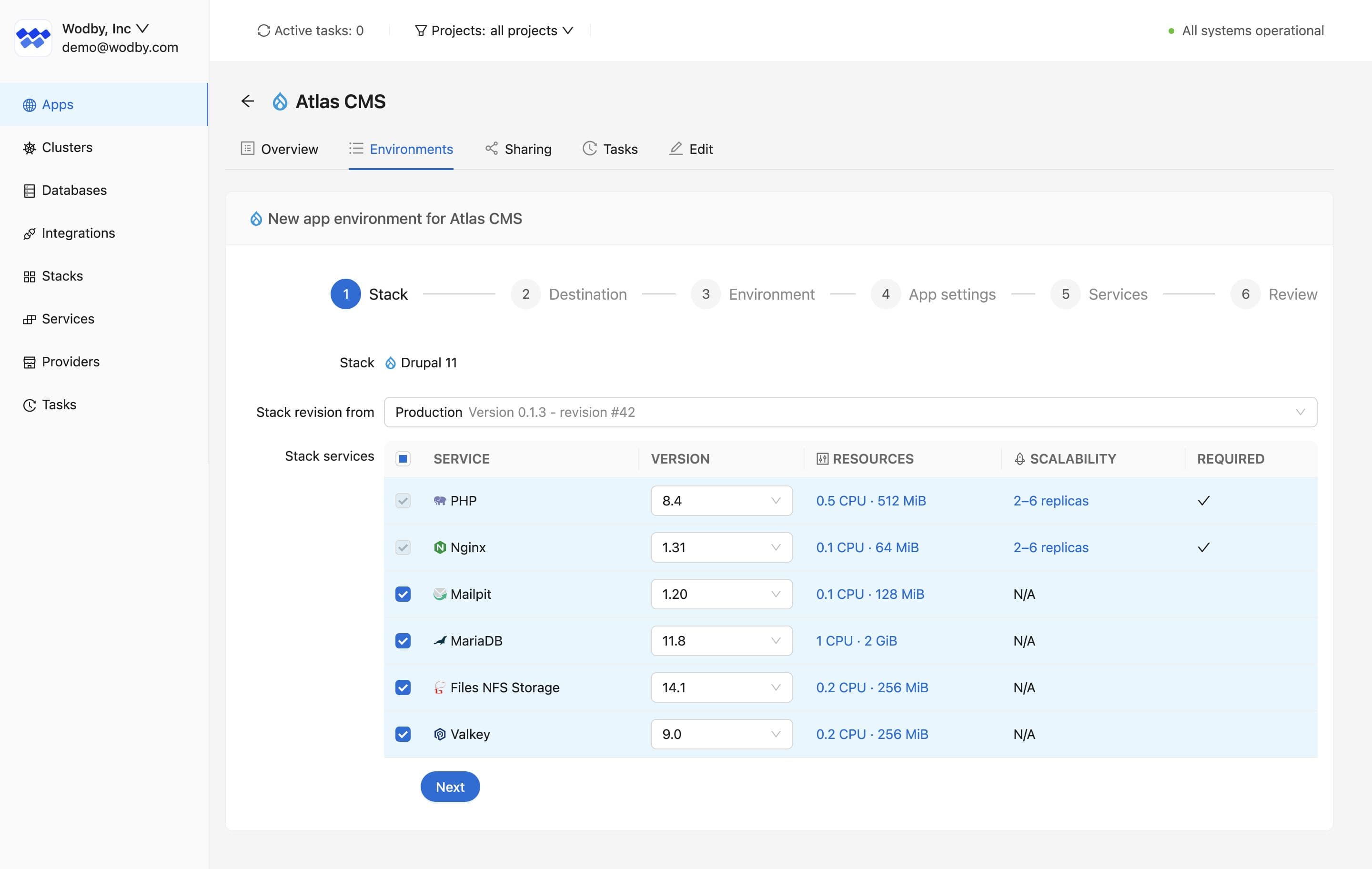 Wodby new environment wizard showing stack revision, services, versions, and resources